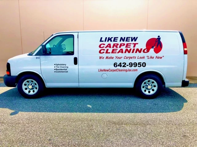 Like New Carpet Cleaning service van with the company name and phone number on the side.